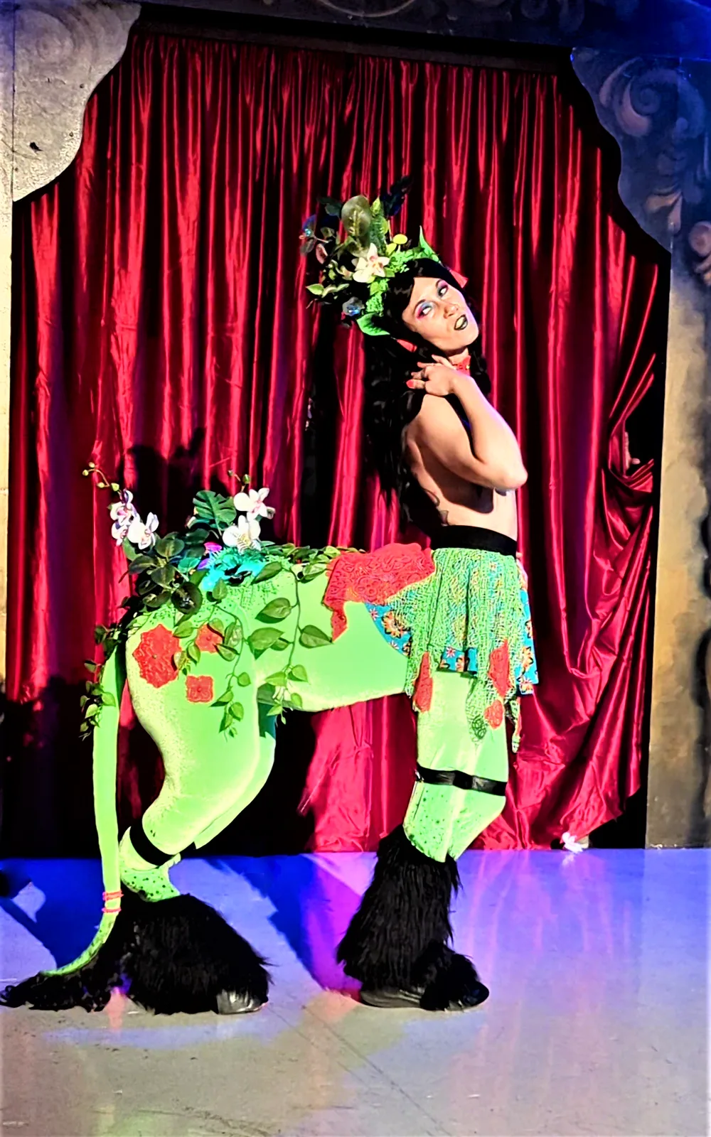 Czarina's trippy mushroom centaur, Mycelia. Made using Ginny D's Centaur of Attention workbook. Back legs move and the flowers on her back are wired with black lights.